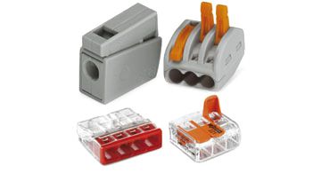 Vier verschiedene WAGO-Klemmen in Grau, Rot und Orange, geeignet zum Verbinden elektrischer Leitungen.